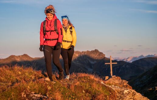 Hiking at the summit cross on the Schwendberg